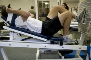 Patient doing exercises after knee surgery