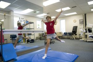 Gymnast landing in physical therapy