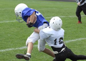 Young football player making a tackle