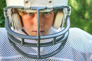 Young football player helmet