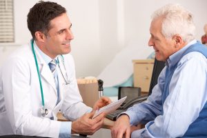 Doctor talking to older patient