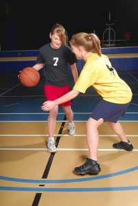 High school girls playing basketball