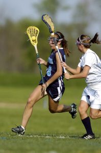 Lacrosse is associated with concussions in female athletes.