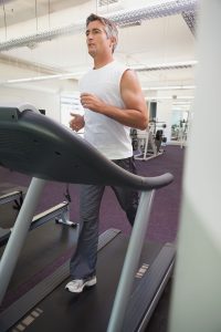 Man on treadmill at gym