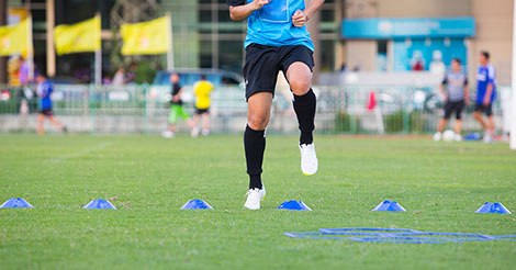 Soccer player doing ACL injury prevention program exercises